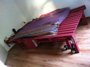 Pallet furniture: double bed, assembled from one euro pallet, one disposable pallet