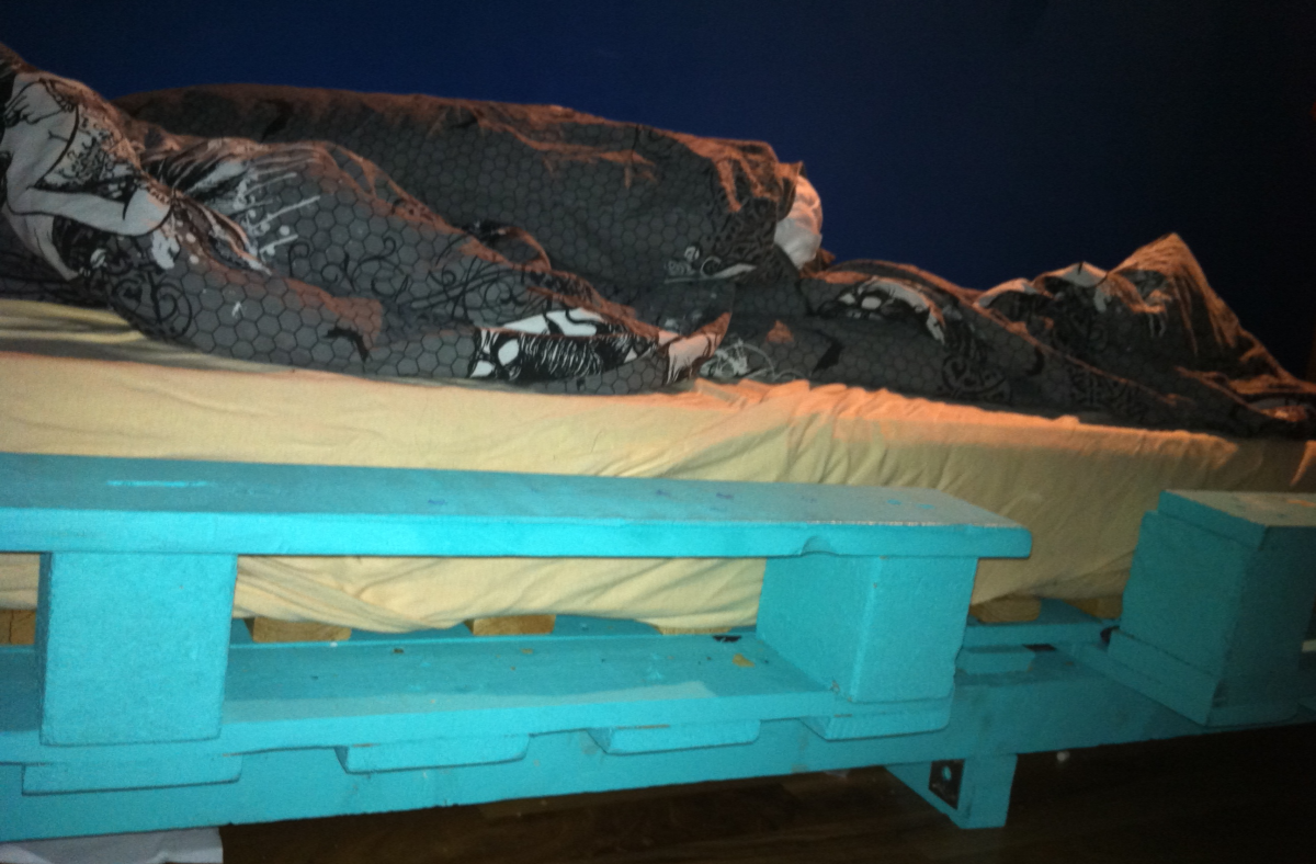 Detail: two euro pallets transformed into a single sized bed, fully assembled