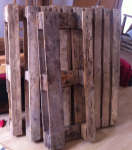 Untreated pallets after cleaning - half an euro-pallet, one disposable pallet and another euro-pallet