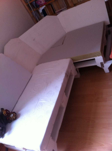 Final sofa assembling: cushioning the sofa corner