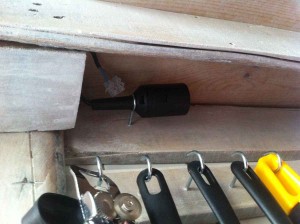 Socket fixed behind veneer on the pallet kitchen shelf