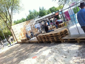 Pallet stage, populated and with exhibition pavillons